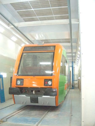 Rail car being prepped in a paint booth